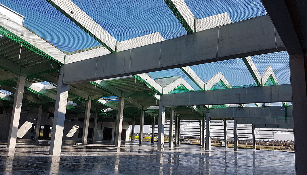 Neubau eines Lager- und Produktionsgebäudes mit Büro und Fachmarkt für Kraft Baustoffe in Höhenkirchen