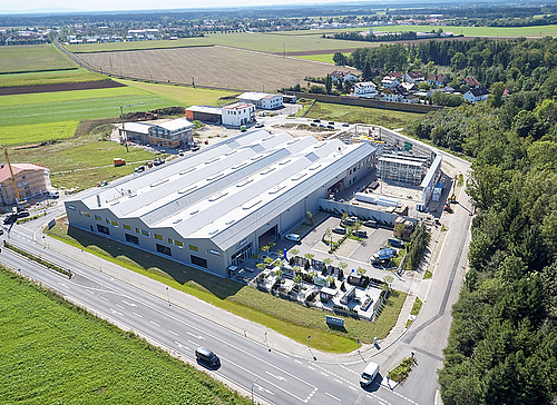 Neubau eines Lager- und Produktionsgebäudes mit Büro und Fachmarkt für Kraft Baustoffe in Höhenkirchen