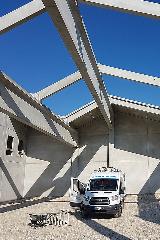 Neubau eines Lager- und Produktionsgebäudes mit Büro und Fachmarkt für Kraft Baustoffe in Höhenkirchen